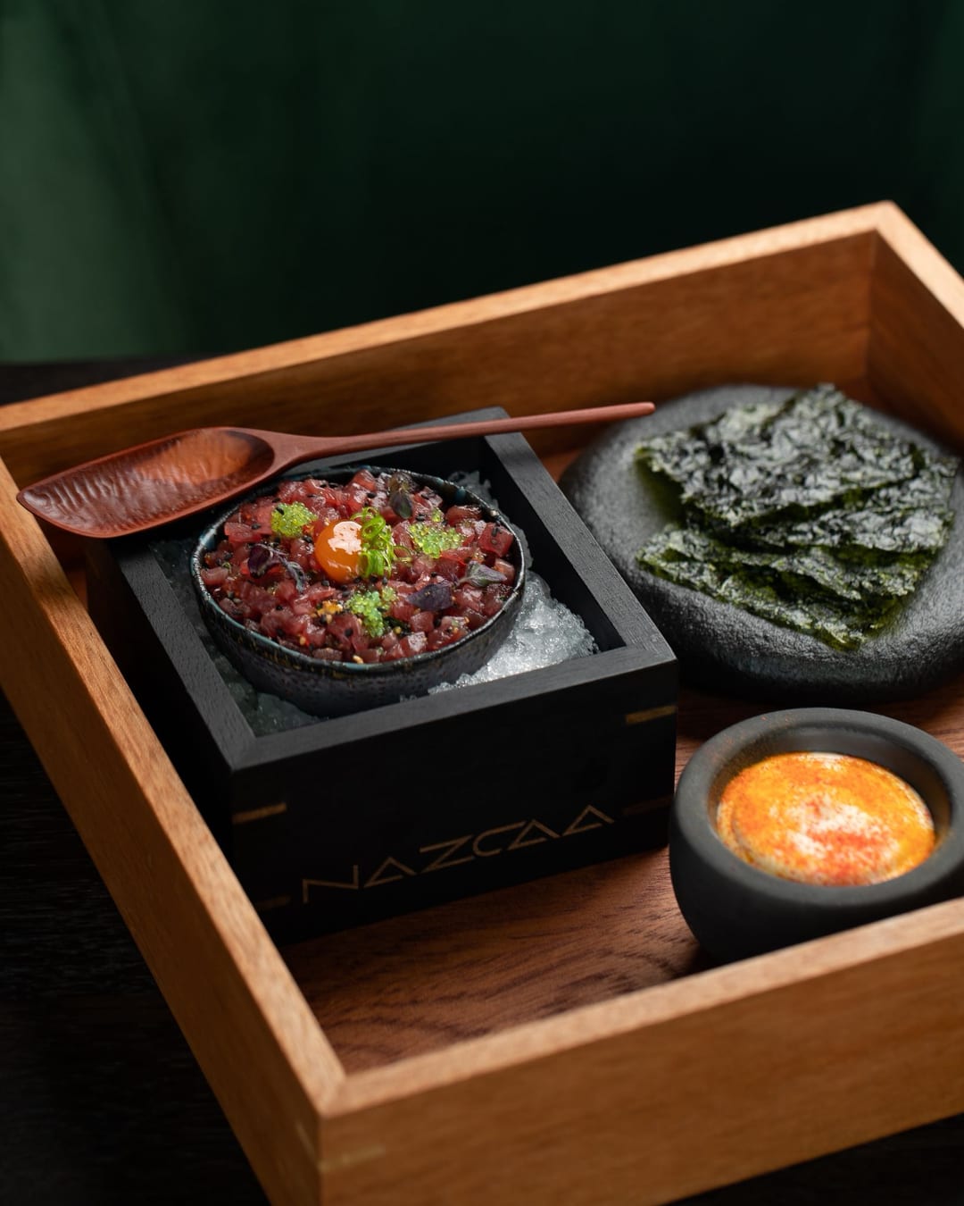 Bento Tuna Tartar at NAZCAA — tuna tartare with furikake rice and marinated quail yolk